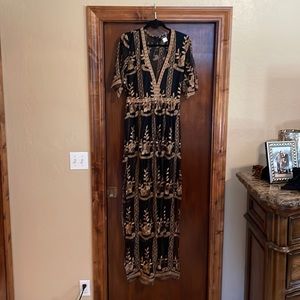 Beautiful sheer black and gold romper dress